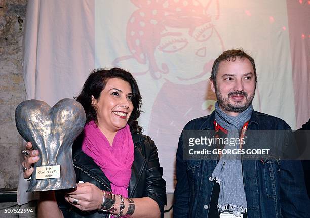 Tunisia's comic book writer Nadia Khiari , author of "Willis from Tunis", flanked with Fluide glacial magazine chief editor Yan Lindingre smiles as...