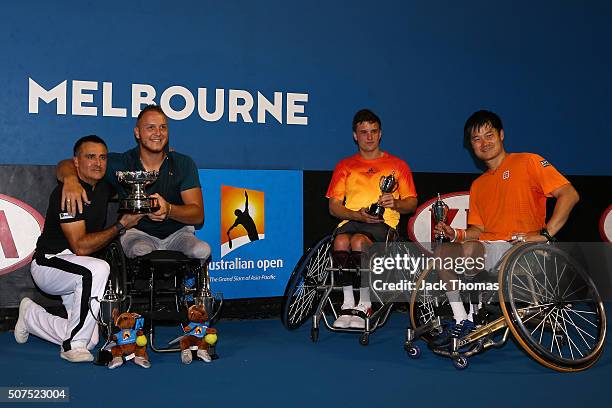 Men's Wheelchair Doubles champions Stephane Houdet and Nicolas Peifer of France pose with runners-up Gordon Reid of Great Britain and Shingo Kunieda...