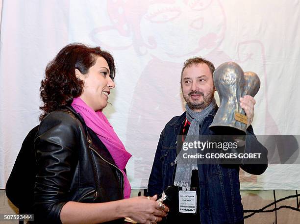 Tunisia's comic book writer Nadia Khiari , author of "Willis from Tunis", receives the "Couilles au cul" Fluide glacial magazine award from the...