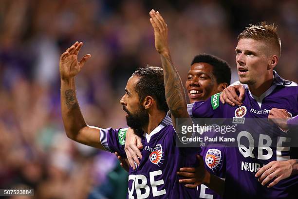 Diego Castro of the Glory celebrates a goal from a penalty kick with Jamal Reiners and Andy Keogh during the round 17 A-League match between Perth...