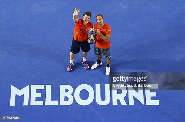 Bruno Soares of Brazil and Jamie Murray of Great Britain pose with the trophy after winning the Men's Doubles Final match against Daniel Nestor of...
