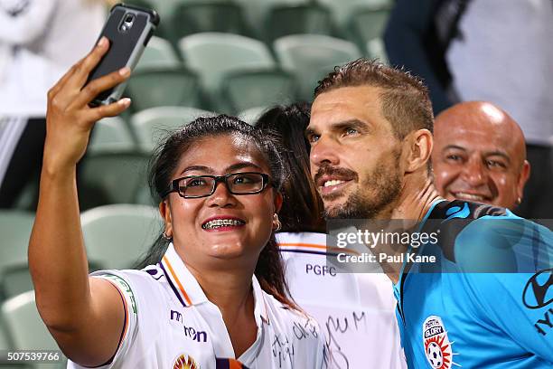 Ante Covic of the Glory poses for a selfie with a supporter after winning the round 17 A-League match between Perth Glory and Melbourne Victory at...