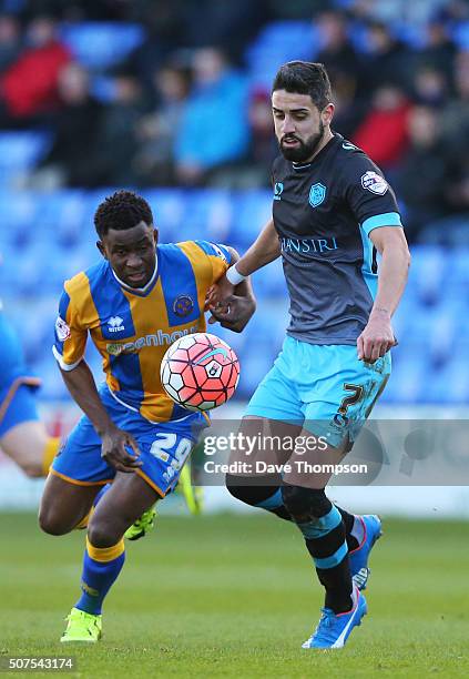 Larnell Cole of Shrewsbury Town and Marco Matias of Sheffield Wednesday compete for the ball during the Emirates FA Cup Fourth Round match between...