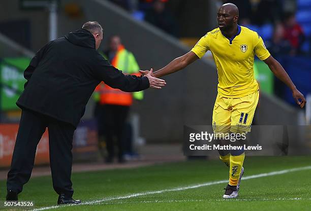 Souleymane Doukara of Leeds United celebrates his goal with manager Steve Evans during The Emirates FA Cup Fourth Round match between Bolton...