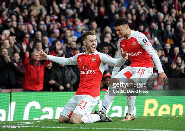 Calum Chambers celebrates scoring a goal for Arsenal with team-mate Alex Oxlade-Chamberlain during the match between Arsenal and Burnley in the FA...