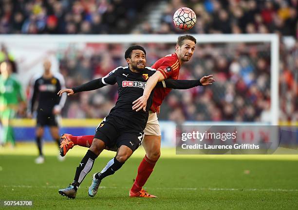 Ikechi Anya of Watford and Chris Cohen of Nottingham Forest compete for the ball during The Emirates FA Cup fourth round between Nottingham Forest...