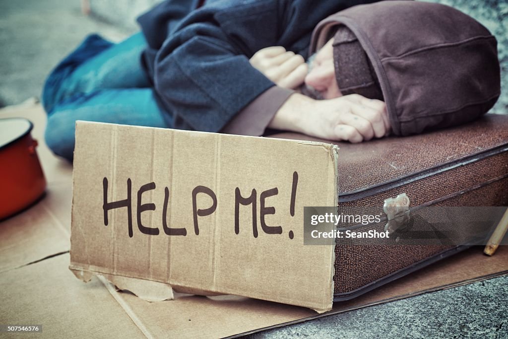 Homeless Holding Cardboard