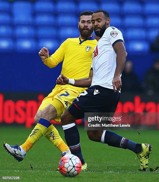 Mirco Antenucci of Leeds United and Liam Trotter of Bolton Wanderers challenge for the ball during The Emirates FA Cup Fourth Round match between...