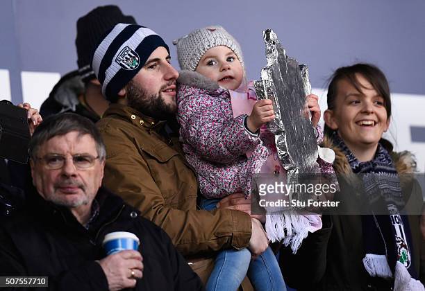 Young West Brom fan holds a 'tin foil' trophy prior to the Emirates FA Cup Fourth Round match between West Bromwich Albion and Peterborough United at...