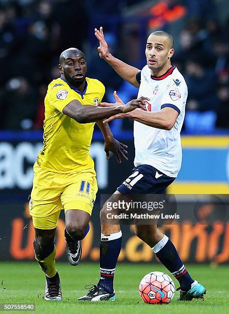 Souleymane Doukara of Leeds United and Darren Pratley of Bolton Wanderers chalenge for the ball during The Emirates FA Cup Fourth Round match between...