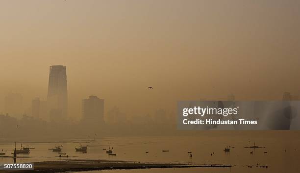 City buildings seen in heavy smog at Bandra, on January 30, 2016 in Mumbai, India. Parts of Mumbai since yesterday are covered in a thick blanket of...