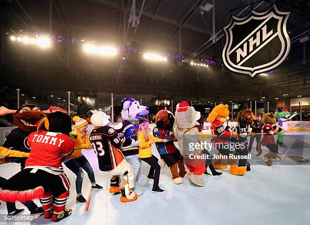 The mascots play tug-o-war game during the NHL Mascot Showdown during day two of the 2016 NHL All-Star NHL Fan Fair at the Music City Center on...