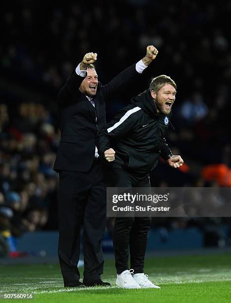 Peterborough United manager Graham Westley and coach celebrate the second Peterborough goal during The Emirates FA Cup Fourth Round match between...