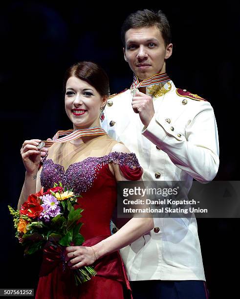 Bronze medalists Ekaterina Bobrova and Dmitri Soloviev of Russia pose during the medal ceremony of Ice Dance on day four of the ISU European Figure...