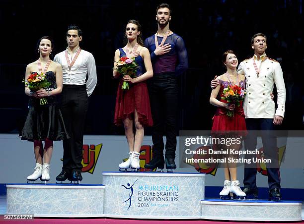 Silver medalists Anna Cappellini and Luca Lanotte of Italy , gold medalists Gabriella Papadakis and Guillaume Czieron of France and bronze medalists...