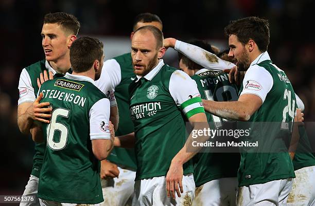 David Gray of Hibernian celebrates at the final whistle during the Scottish League Cup Semi final match between Hibernian and St Johnstone at...