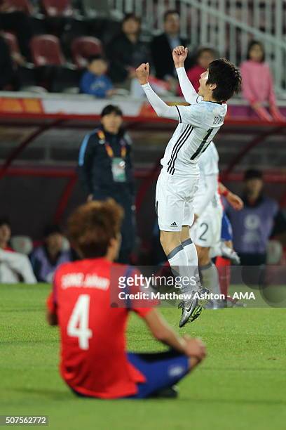 Dejected Song Ju Hun of South Korea as Toyokawa Yuta of Japan celebrates victory on the final whistle in the AFC U-23 Championship final match...