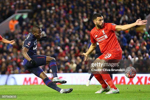 Enner Valencia of West Ham United shoots past Steven Caulker of Liverpool during the Emirates FA Cup Fourth Round match between Liverpool and West...