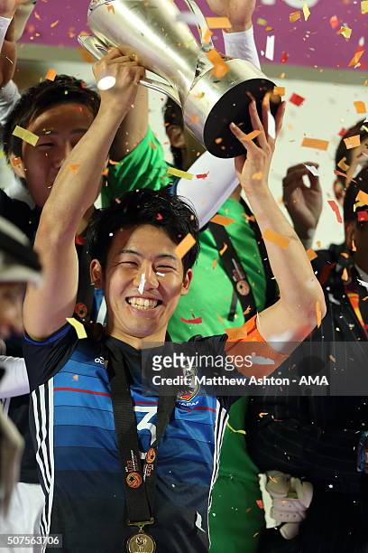 Endo Wataru of Japan lifts the trophy after the AFC U-23 Championship final match between South Korea and Japan at the Abdullah Bin Khalifa Stadium...