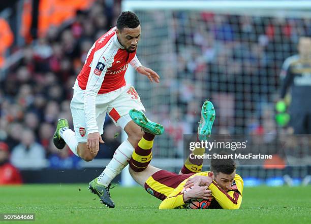 Francis Coquelin of Arsenal challenges Burnley's David Jones during the The Emirates FA Cup Fourth Round match between Arsenal and Burnley at...