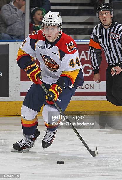 Travis Dermott of the Erie Otters skates with the puck against the London Knights during an OHL game at Budweiser Gardens on January 29, 2016 in...