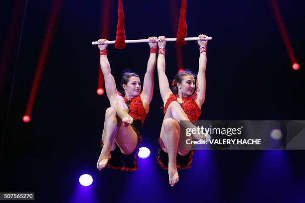 Italian trapeze duo Sarah and Adriana Togni perform during the 5th New Generation circus competition for young artists in Monaco on January 30, 2016....