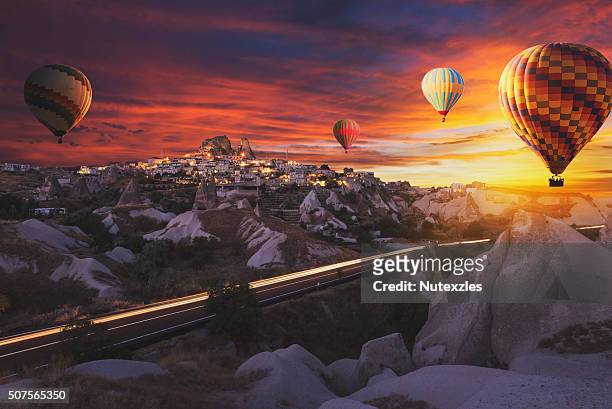 hot air balloons flying over cappadocia. - cappadocia hot air balloon stock pictures, royalty-free photos & images