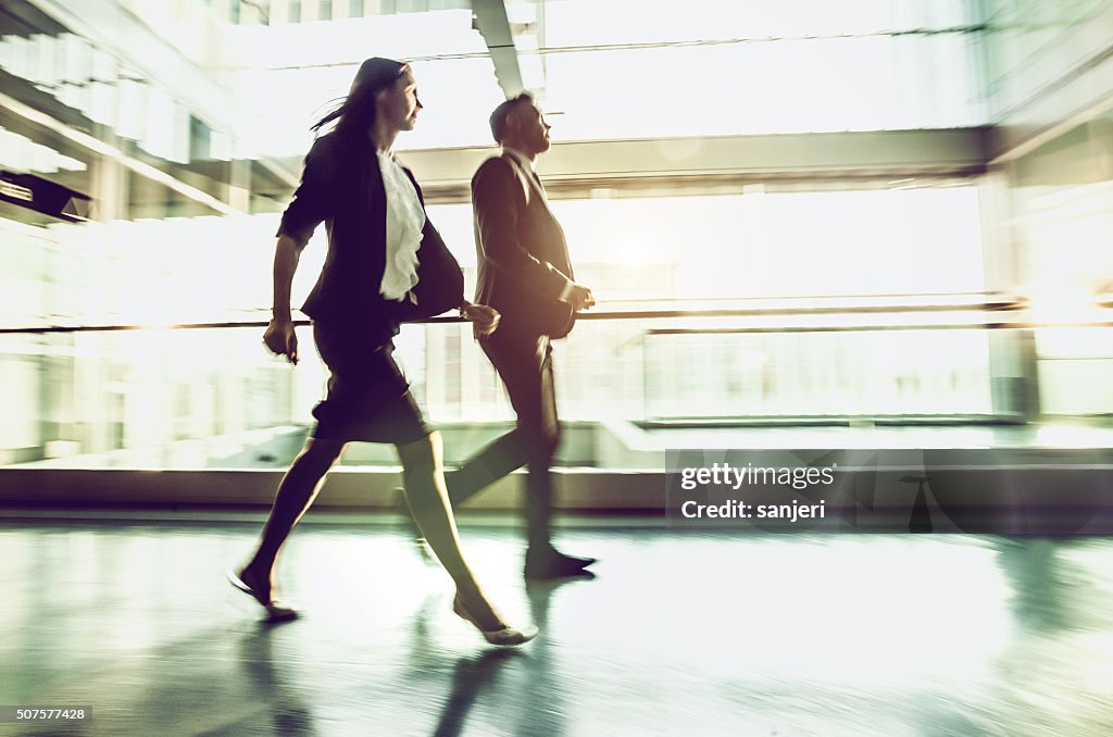 Business people walking at the lobby