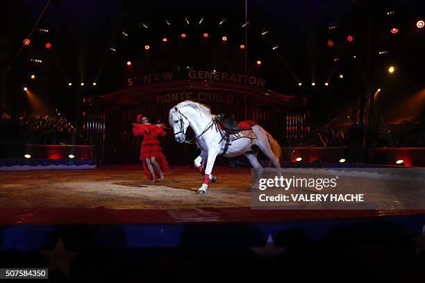 An acrobat performs with a horse during the performance of Germany's Rene Casselly Jr during the 5th New Generation circus competition for young...