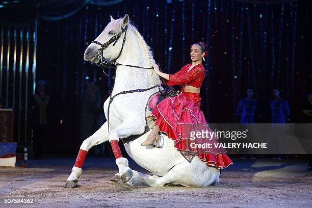 An acrobat performs with a horse during the performance of Germany's Rene Casselly Jr during the 5th New Generation circus competition for young...