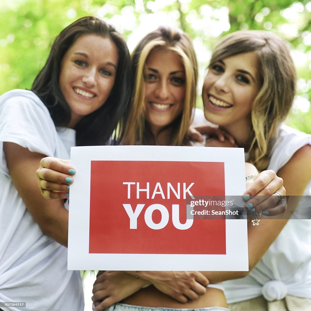 Friends With 'Thank You' Sign