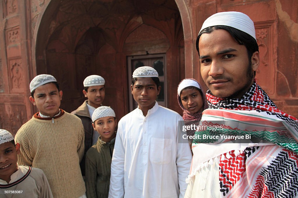 Young men in Taqiyah cap