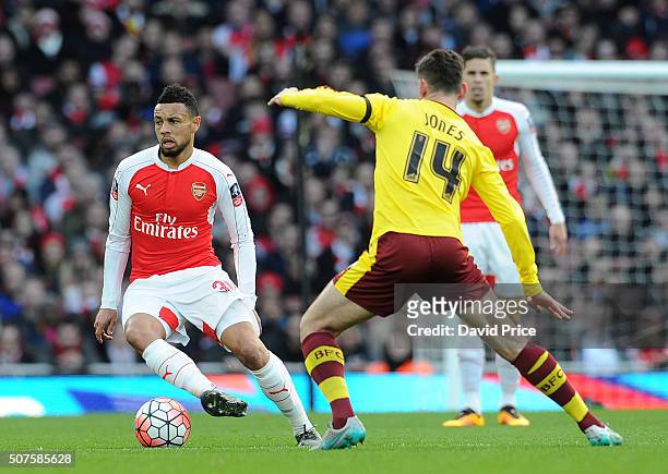 Francis Coquelin of Arsenal takes on David Jones of Burnleyduring the Emirates FA Cup Fourth Round match between Arsenal and Burnley in the FA Cup...