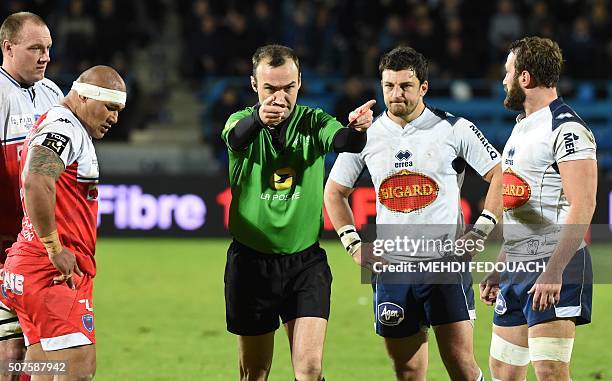 The referee shows a red card to players of Grenoble's Sona Taumalolo and Agen's player Remi Vaquin before asking the players to leave the field...