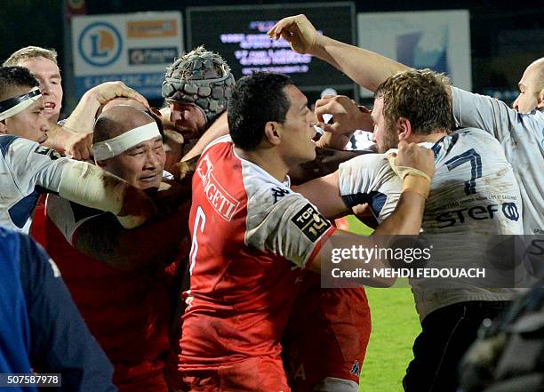 Players try to separate the two players Grenoble's Sona Taumalolo and Agen's player Remi Vaquin during the French Top 14 rugby union match Agen vs...