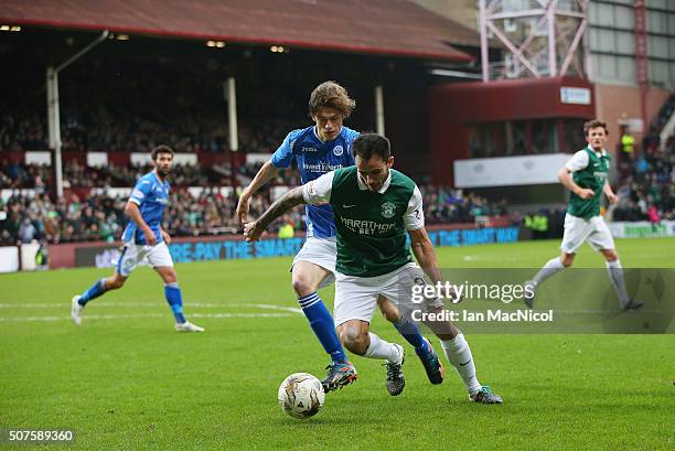 Murray Davidson of St Johnstone vies with Chris Dagnall of Hibernian during the Scottish League Cup Semi final match between Hibernian and St...