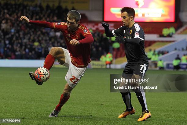 Gary Gardner of Nottingham Forest and Jose Manuel Jurado of Watford in action during the Emirates FA Cup Fourth Round match between Nottingham Forest...