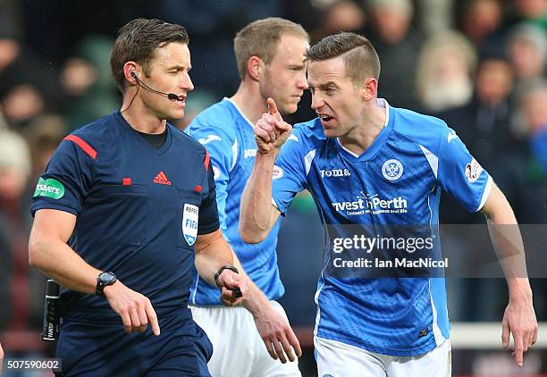 Stephen MacLean of St Johnstone remonstrates with referee Steven McLean during the Scottish League Cup Semi final match between Hibernian and St...