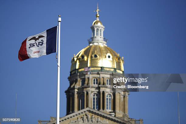The Iowa state flag flies outside the State Capitol Building in Des Moines, Iowa, U.S., on Friday, Jan. 29, 2016. As the first in the nation Iowa...