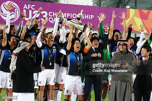 Endo Wataru of Japan lifts the trophy after the AFC U-23 Championship final match between South Korea and Japan at the Abdullah Bin Khalifa Stadium...