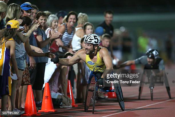 Kurt Fearnley greets the crowd after winning the Mens 1500m wheelchair during the 2016 Hunter Track Classic on January 30, 2016 in Newcastle,...