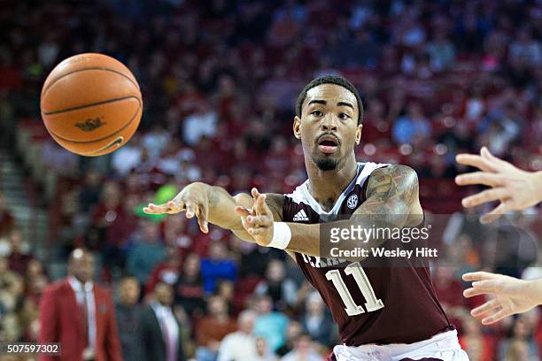 Anthony Collins of the Texas A&M Aggies makes a pass during a game against the Arkansas Razorbacks at Bud Walton Arena on January 27, 2016 in...