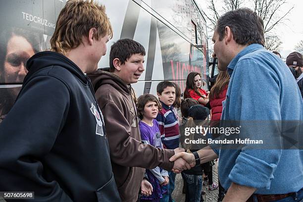 Republican presidential candidate Sen. Ted Cruz greets children following a campaign event at Darrell's Place on January 30, 2016 in Hamlin, Iowa....