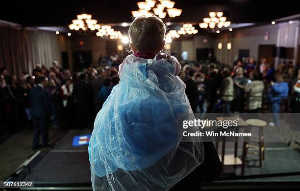 Dresses as a princess, Evelyn Schroedermier sits on her father Clark's shoulders, while waiting to greet Democratic presidential candidate former...