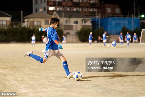 youth soccer player in tokyo japan - sports activity stock pictures, royalty-free photos & images
