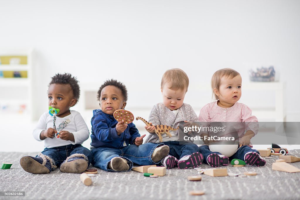 Babies playing together in preschool.