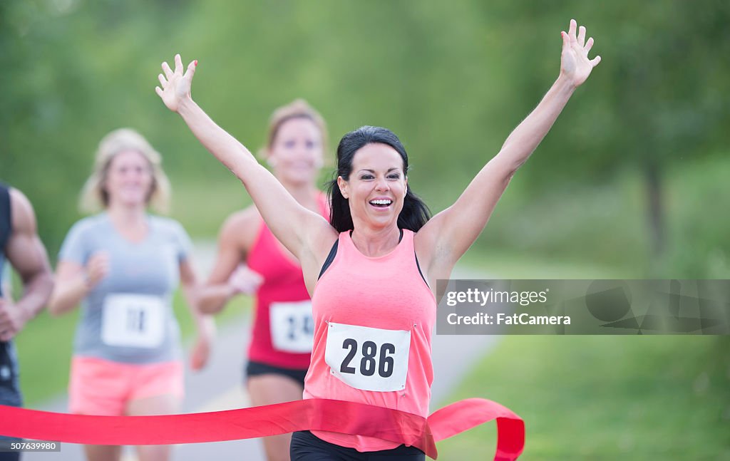 Runners Winning Competetive Runner Winning A Race High-Res Stock Photo - Getty Images