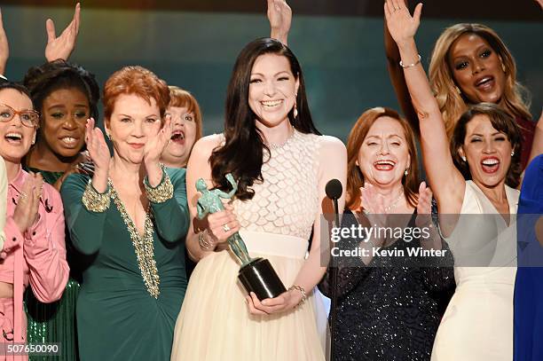 Actress Laura Prepon and the cast of 'Orange Is The New Black' accept the award for Oustanding Ensemble in a Comedy Series onstage during The 22nd...