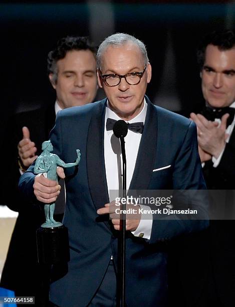 Actor Michael Keaton with actors Mark Ruffalo and Brian d'Arcy James accept Outstanding Performance by a Cast in a Motion Picture for 'Spotlight'...