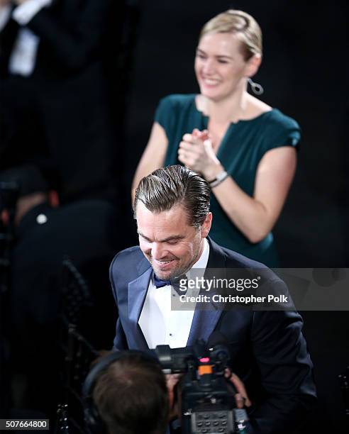 Actress Kate Winslet applauds as actor Leonardo DiCaprio accepts the award for Outstanding Performance by a Male Actor in a Leading Role for 'The...